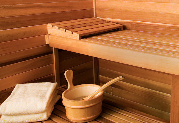 Inside of a sauna | SDS Australia Towels ladel and a bucket inside a sauna