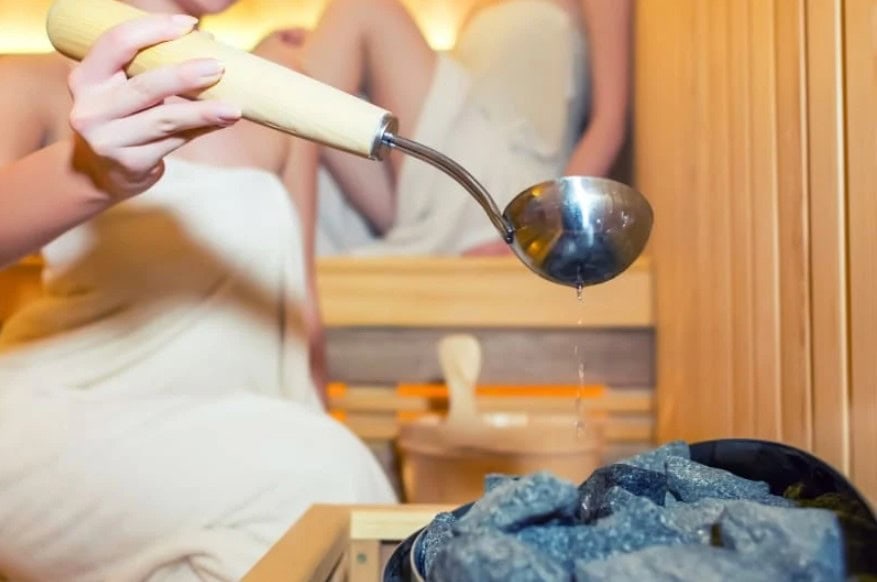 Water on Sauna Rocks | SDS Australia Water being placed on Sauna Rocks